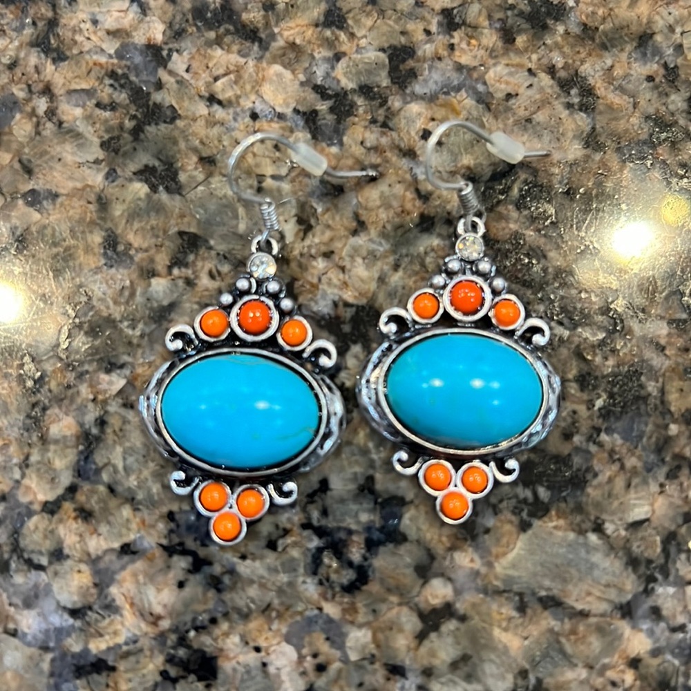 Blue turquoise earrings set in silver metal